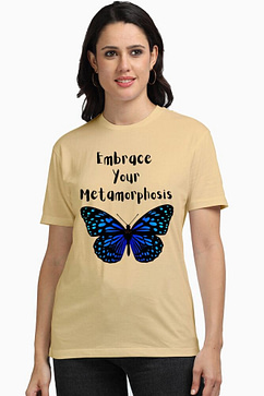 A woman in a casual beige women t shirt print featuring a blue butterfly