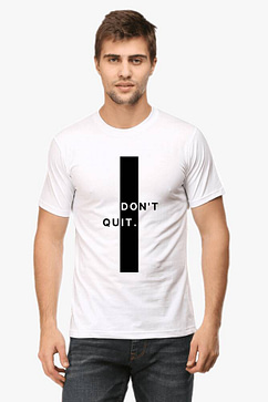 Person wearing a white motivational t shirt featuring a central black rectangle with indistinct motivational text