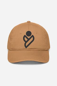 A tan baseball cap with a distinctive dark brown logo