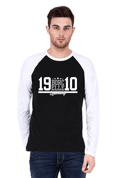 A man in a stylish raglan t-shirt stands against a plain background, his white and black shirt featuring the bold text "BORCELLE 19 10.